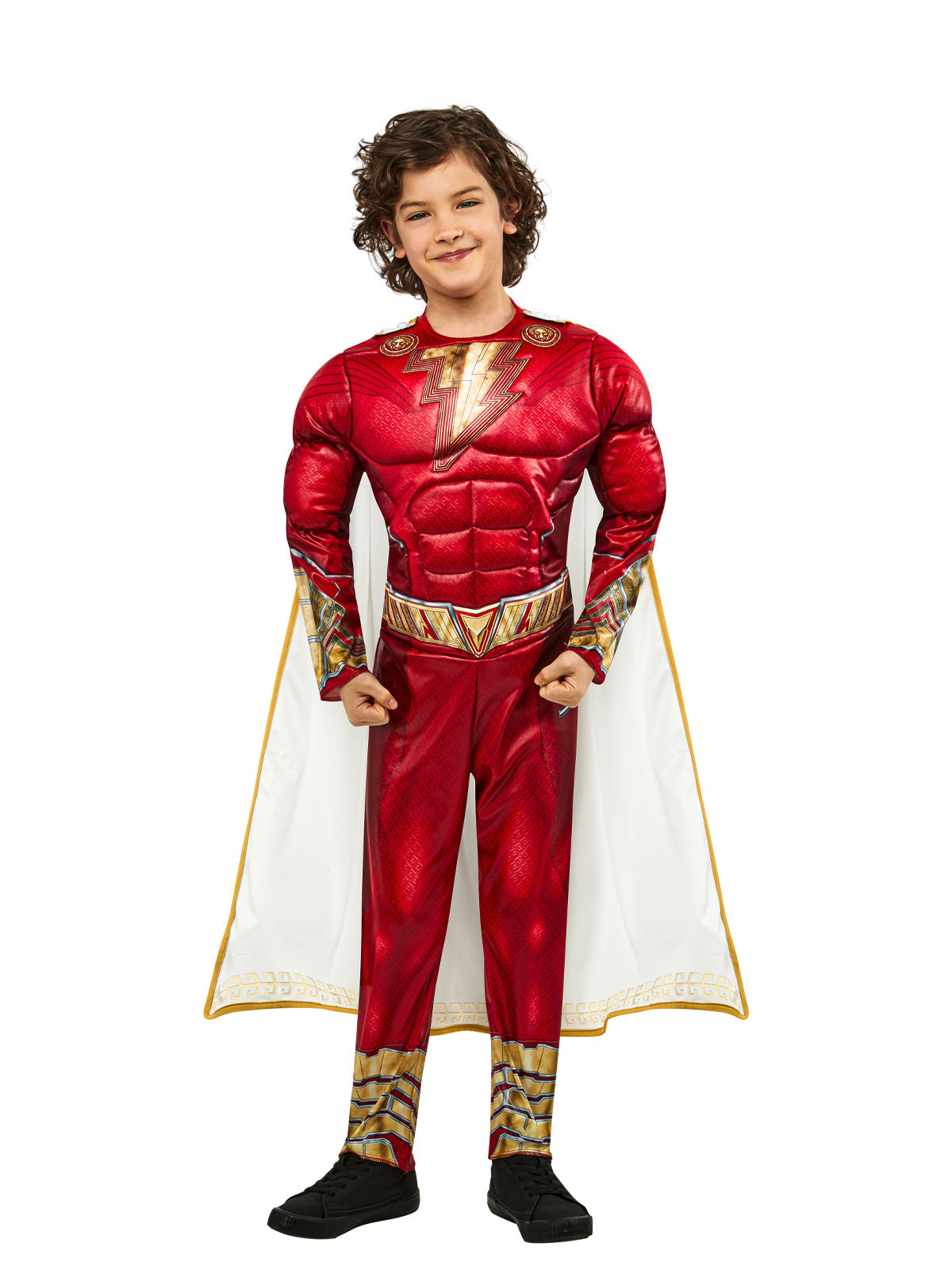 Boy wearing a red Shazam muscle jumpsuit with gold lightning bolt, belt print and white and gold cape
