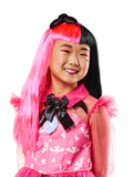 Girl wearing the long pink and black Draculaura wig with a bow