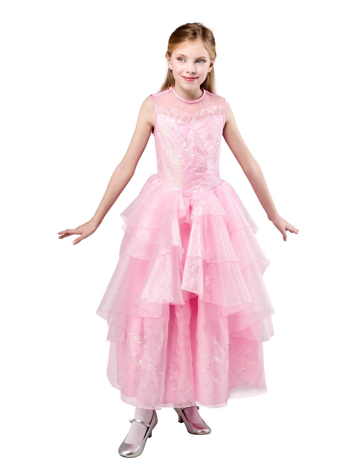 Girl in the long pink Glinda dress with her hands by her sides