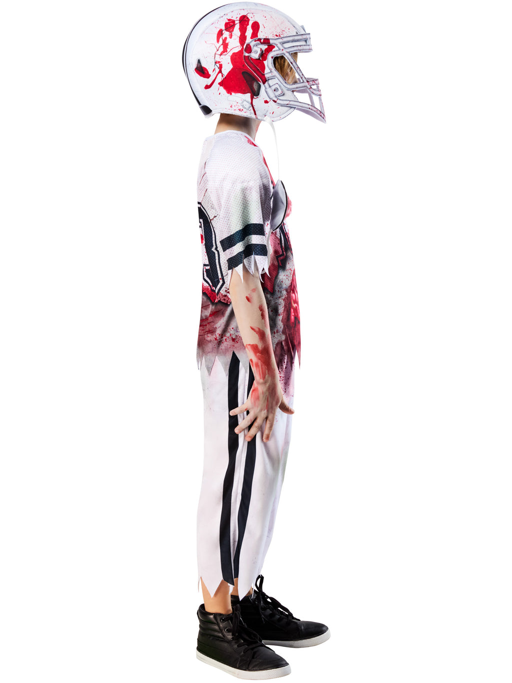 Side view of a boy in the Zombie American Football Player costume with blood-splattered helmet
