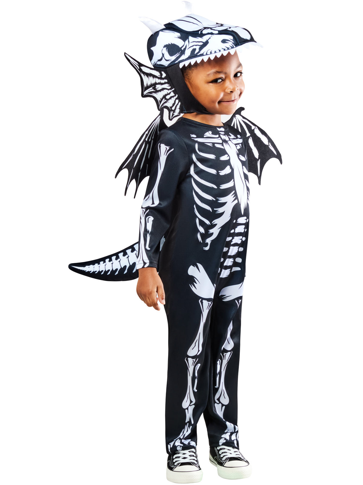Child posing in the skeleton dragon jumpsuit with detachable tail and wings