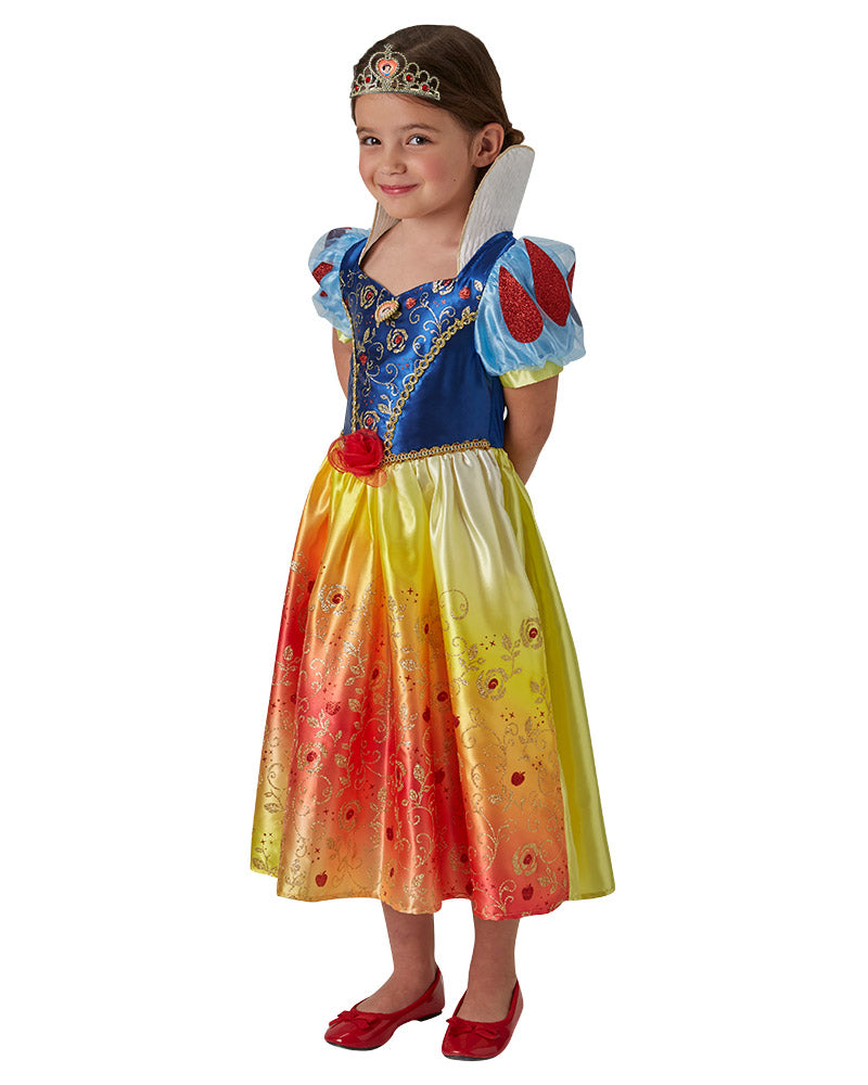 Girl wearing a Snow White Rainbow dress with blue satin bodice, puff sleeves and rainbow glitter skirt, plus tiara