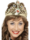 Woman wearing a gold queen's crown set with coloured jewels