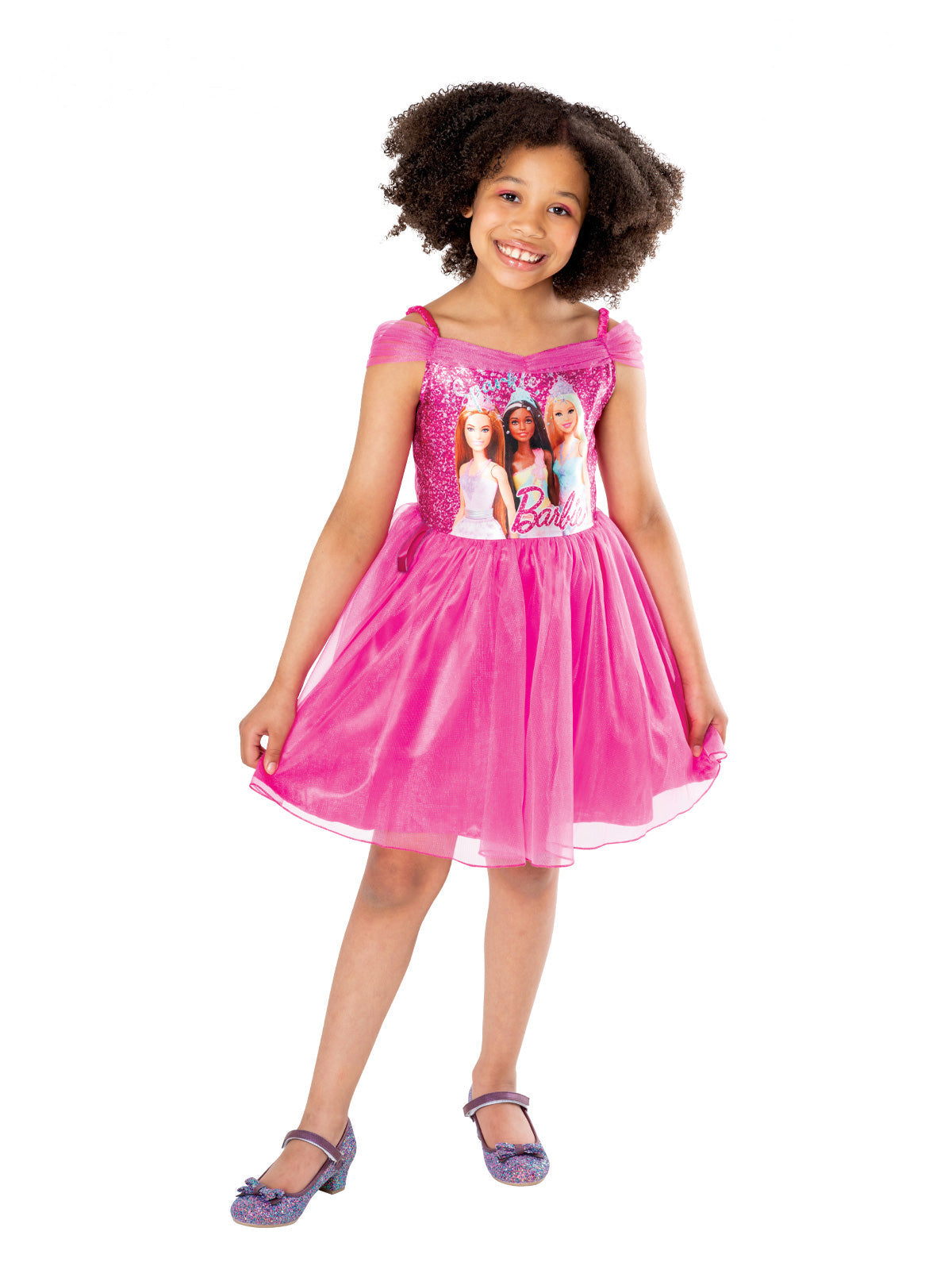 Girl wearing a pink Barbie & Friends tutu dress with three Barbie dolls printed on the shimmery bodice
