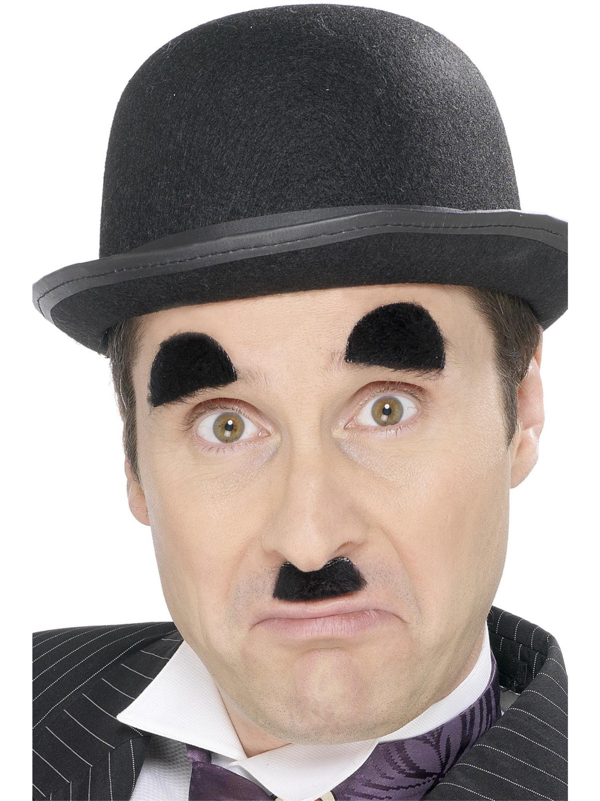Man in a bowler hat wearing a black silent film toothbrush moustache and matching eyebrows