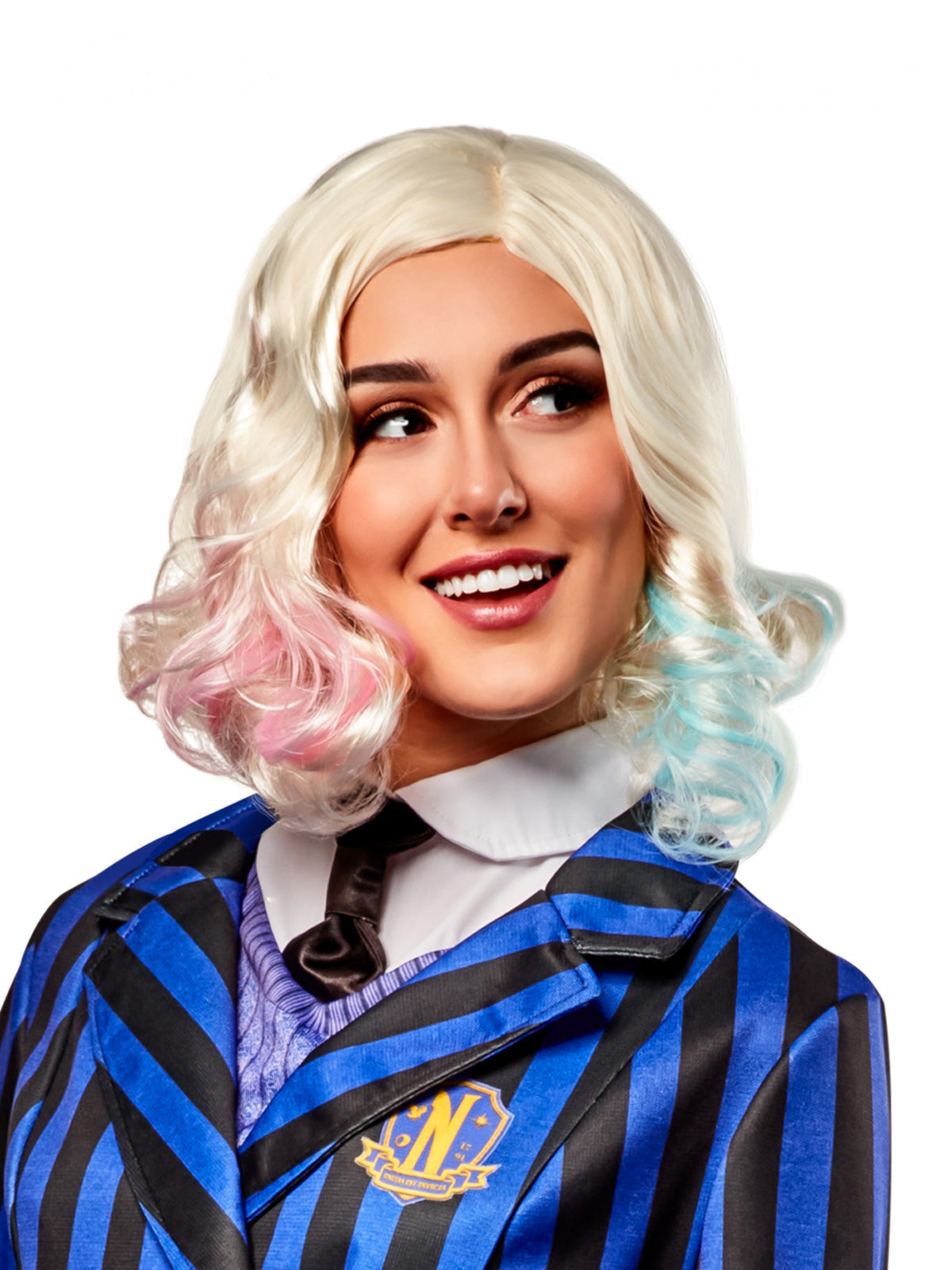 Woman wearing a wavy platinum blonde Enid wig with pink and blue tips