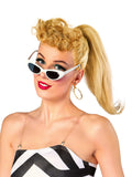 Woman in a blonde ponytail wearing white cat-eye sunglasses and gold hoop earrings from the Barbie 1959 set