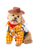 Dog in the Woody Toy Story pet costume, yellow check shirt, cow-print vest, red kerchief and brown hat