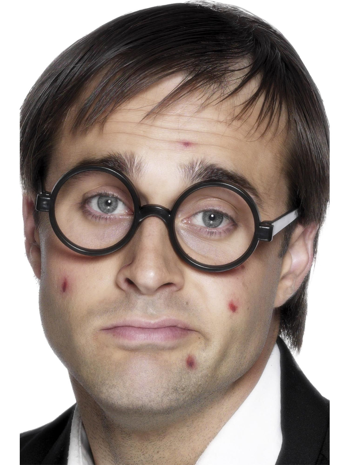 Man wearing round black schoolboy specs