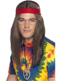 Man wearing a long brown hippie wig, red headband, round glasses and peace sign medallion