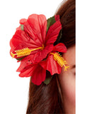 Large red hibiscus flower hair clip worn in long brown hair