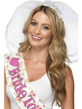 Woman wearing a white hen night veil on a headband