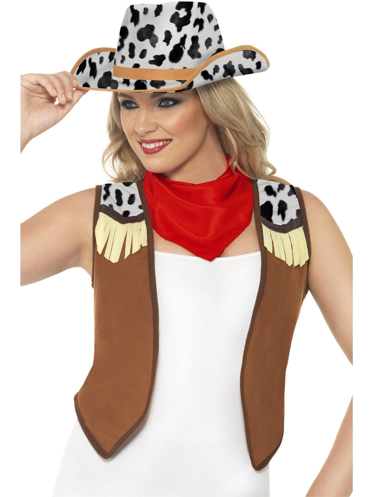 Woman wearing a cow print cowboy hat, red neckerchief and brown fringed waistcoat
