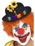 Clown wearing a black bowler hat with rainbow band and sunflowers