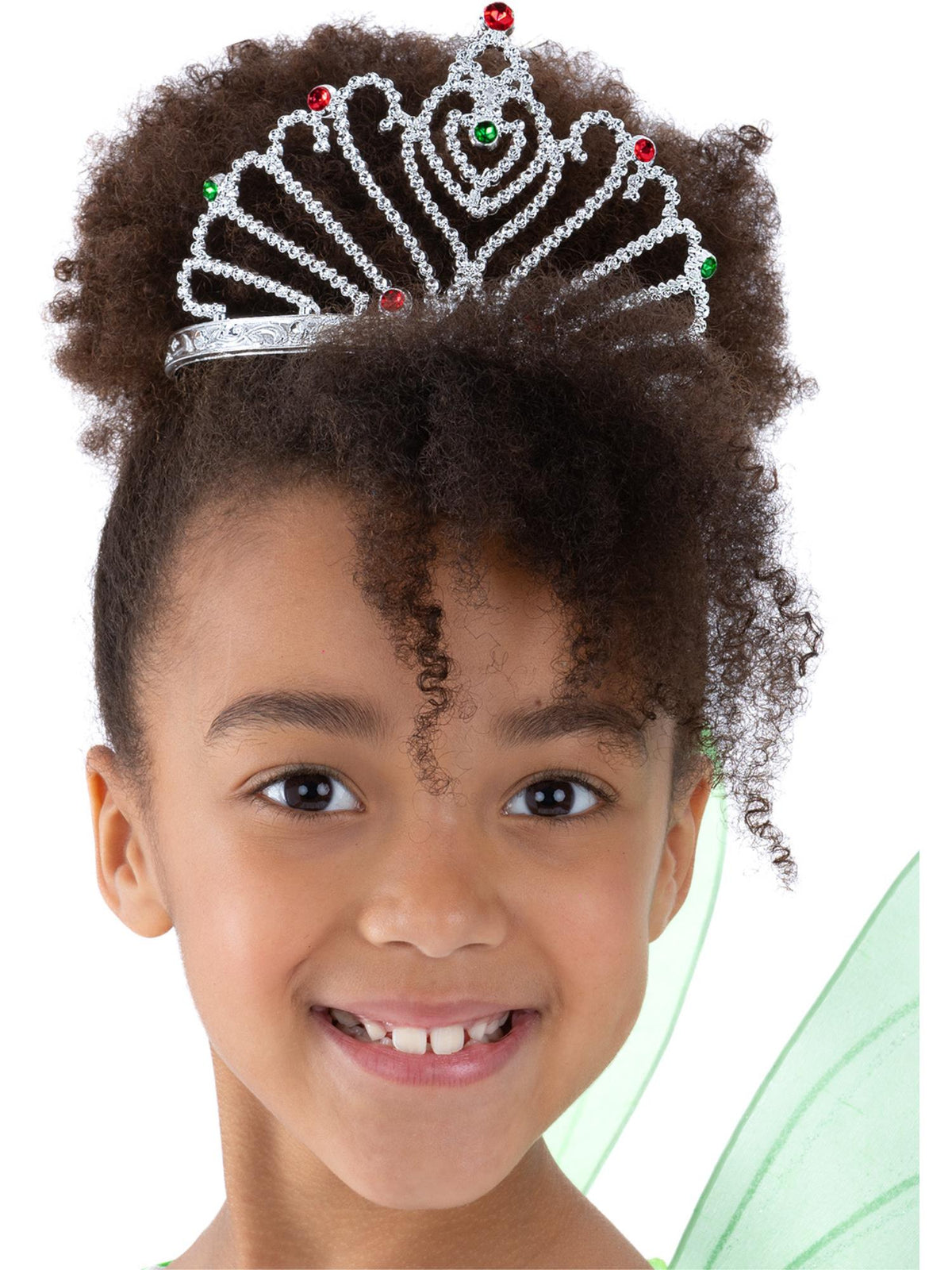 Girl wearing a silver fan design tiara with red jewels