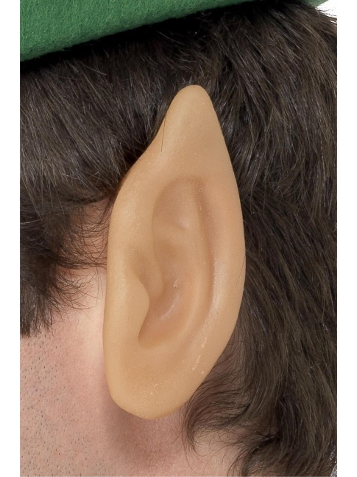Close-up of a flesh-coloured pointed vinyl elf ear