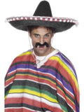 Man wearing a black straw sombrero with white pom pom trim