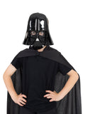 Child wearing the black Darth Vader mask and cape