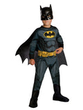 Boy in classic Batman jumpsuit with yellow bat emblem and belt, attached boot tops, cape and mask