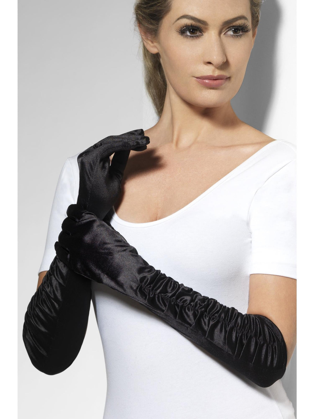 Woman wearing long black satin temptress gloves with ruched sleeves
