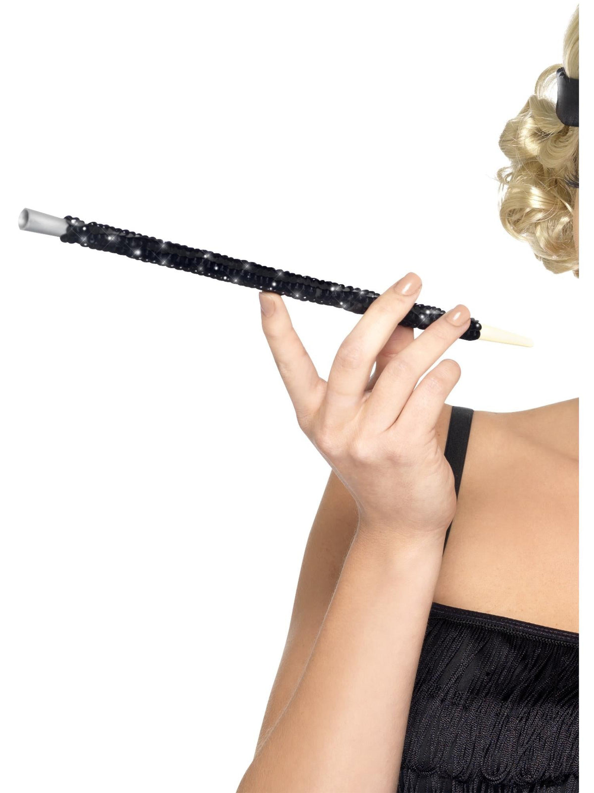 Hand holding a black sequinned cigarette holder