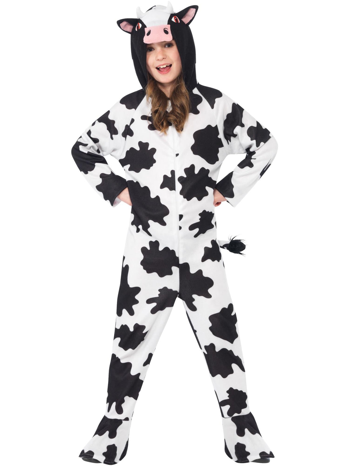 Child in cow print hooded onesie with horned hood, standing hands on hips