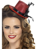 Woman wearing a red glitter mini top hat with black band and black feathers