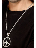 Silver peace sign medallion on a silver chain worn over a black top