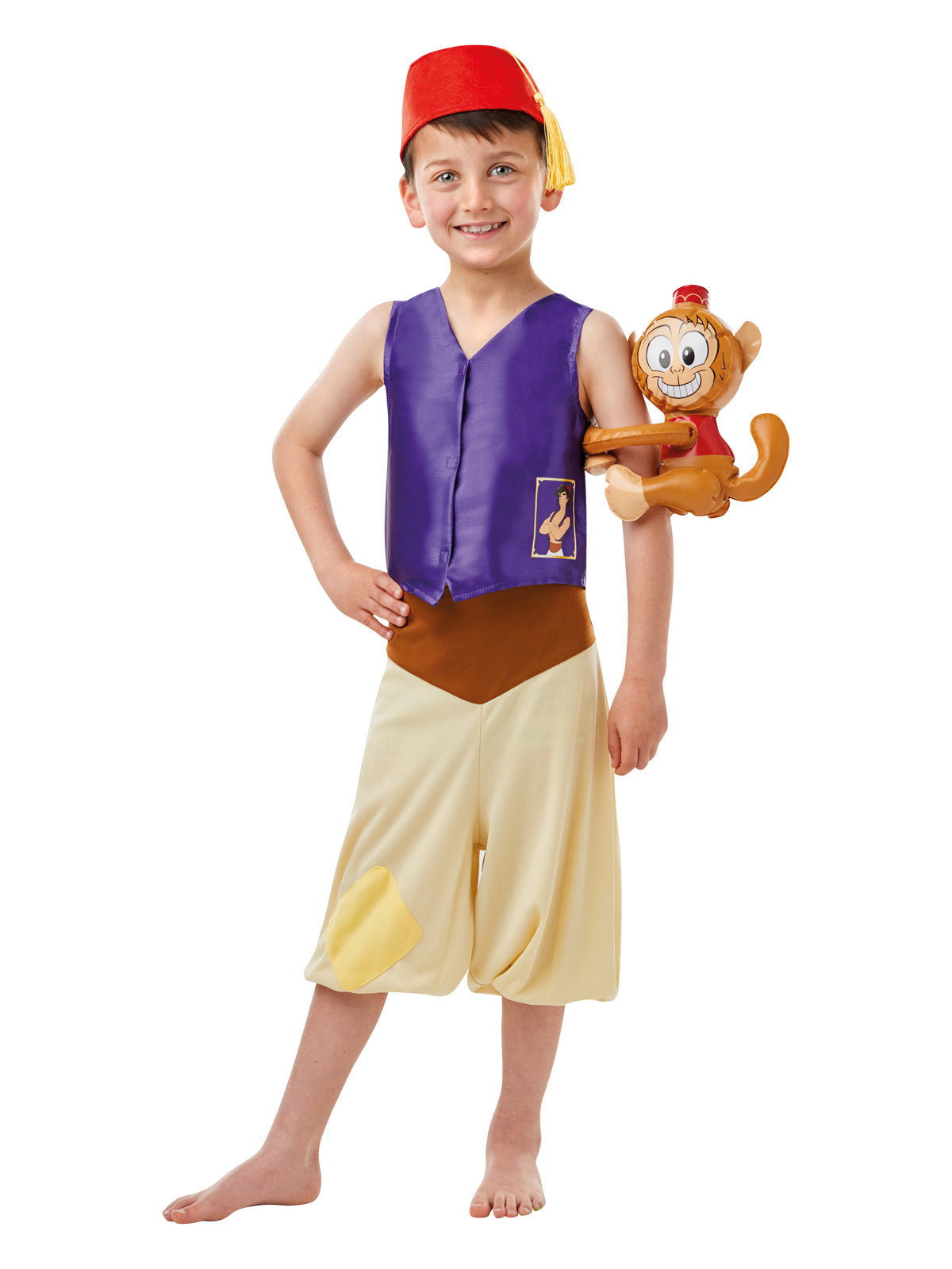 Boy in Aladdin costume with purple vest, cream knickerbocker pants, red hat and inflatable Abu monkey