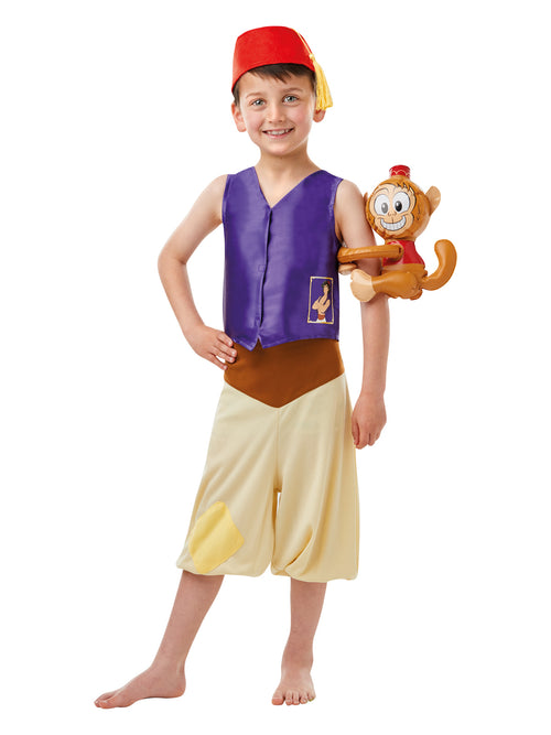 Boy in Aladdin costume with purple vest, cream knickerbocker pants, red hat and inflatable Abu monkey