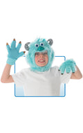 Child wearing the blue furry Sully headpiece and matching gloves
