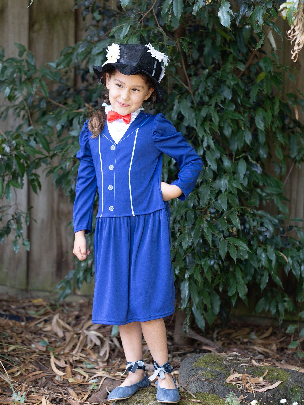 Girl in the Disney Mary Poppins blue drop-waist dress with a red bow tie collar and flowered black felt hat