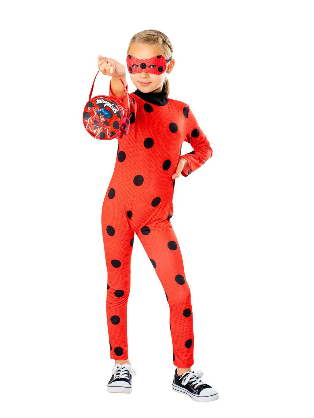 Girl in a red spotted Ladybug jumpsuit holding the red bag and wearing the mask