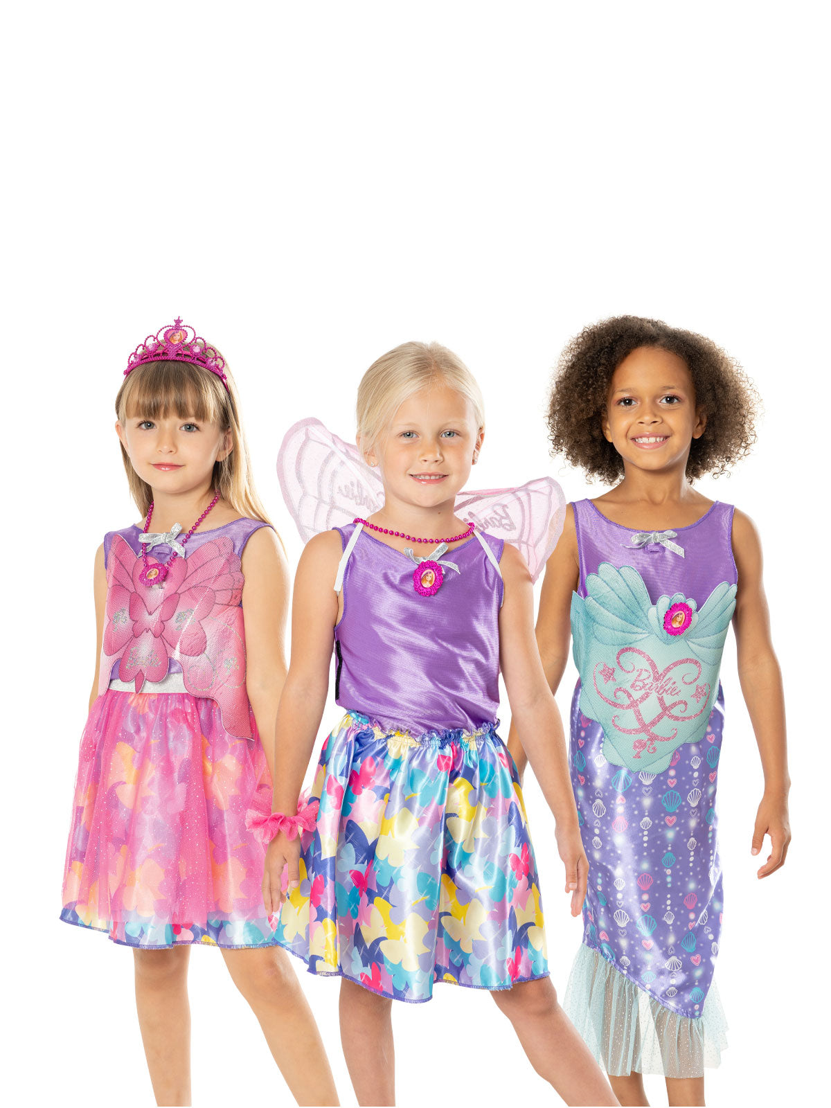 Three girls in Barbie dress-up skirts and tops from the trunk set