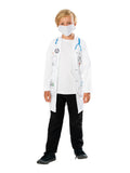 Child in doctor costume with printed white coat-style shirt and white face mask