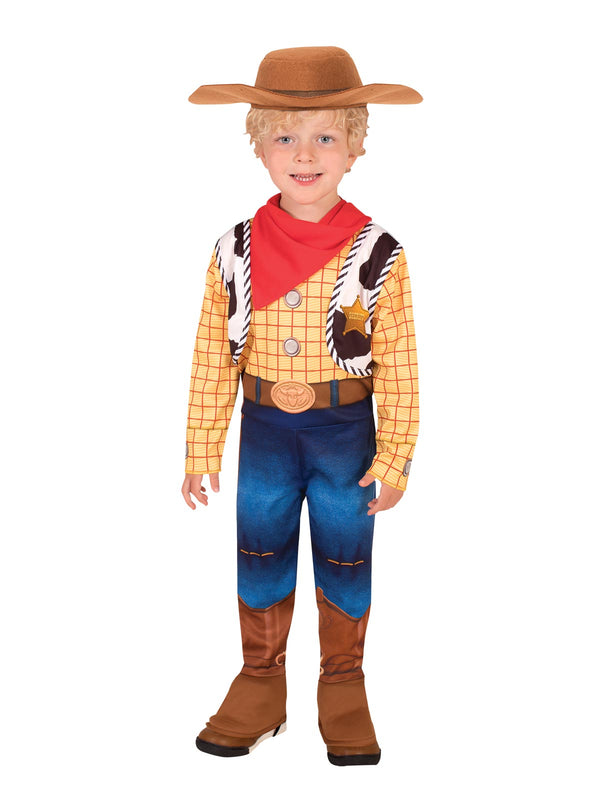 Boy wearing a Woody Toy Story printed cowboy jumpsuit with vest, holster, boot tops, red bandana and brown hat