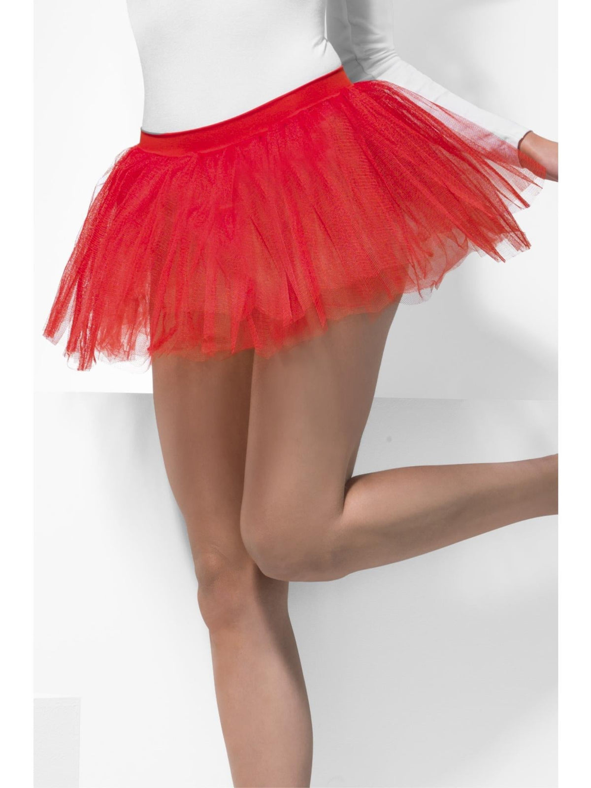 Woman wearing a short red layered tutu underskirt