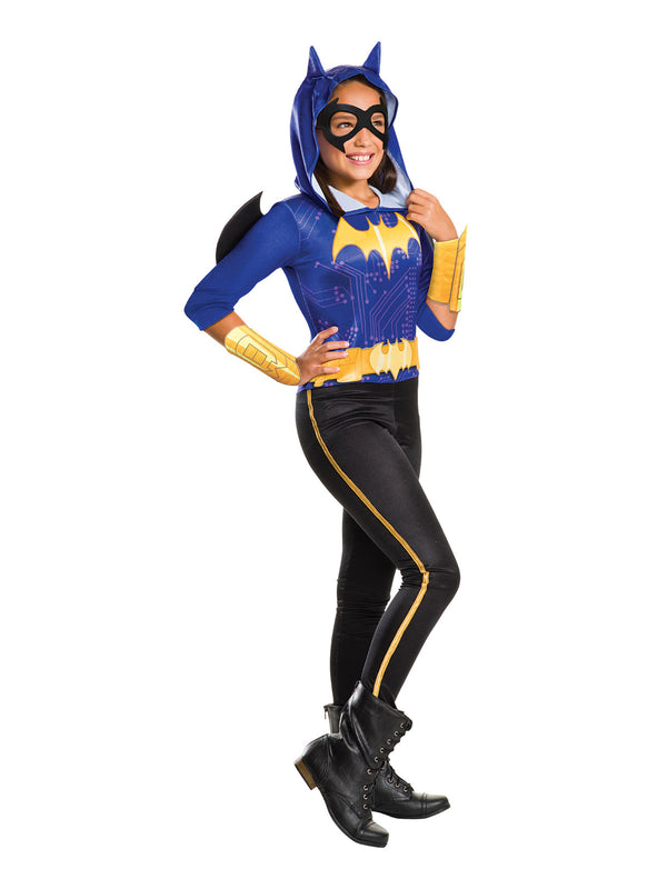 Older girl in DC Super Hero Girls Batgirl hooded jumpsuit with bat emblem, gold gauntlets and striped pants