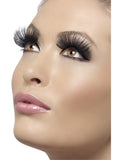 Close-up of long thick black false eyelashes