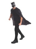 Man wearing a black Batman half mask and flowing black cape