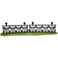 White Stormtrooper helmet fence decor pieces joined in a row