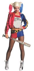 Woman in a Harley Quinn costume holding the inflatable Good Night bat