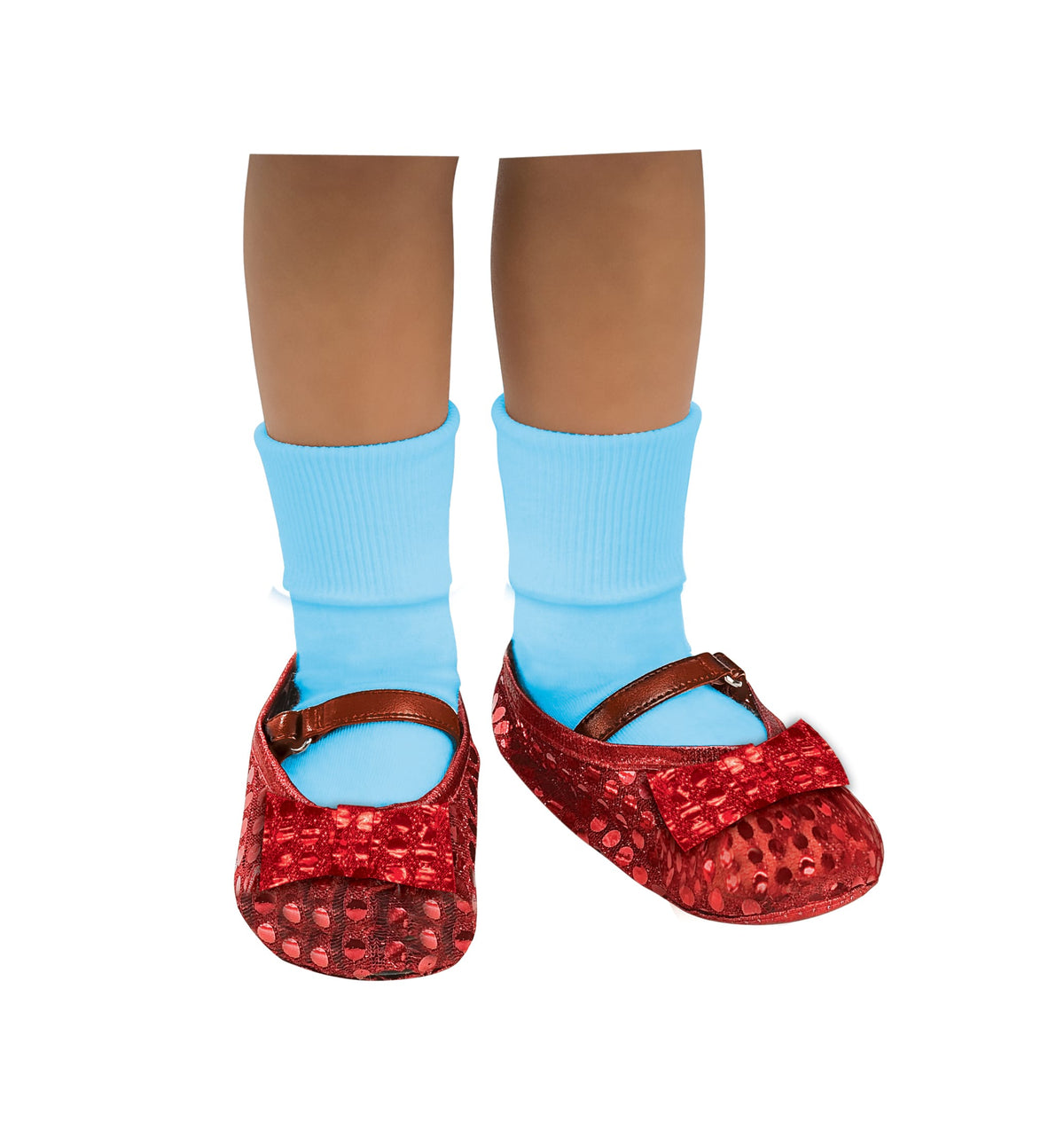 Child's feet in red sequin Dorothy shoe covers with bows