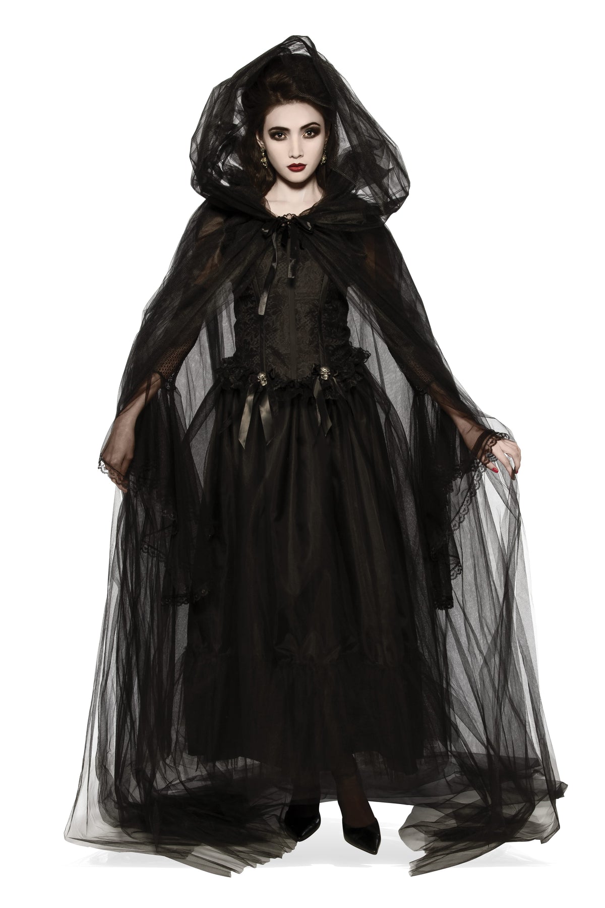 Woman wearing a long sheer black tulle cape with a large hood