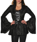 Woman wearing a black crushed velvet corset top with trumpet sleeves
