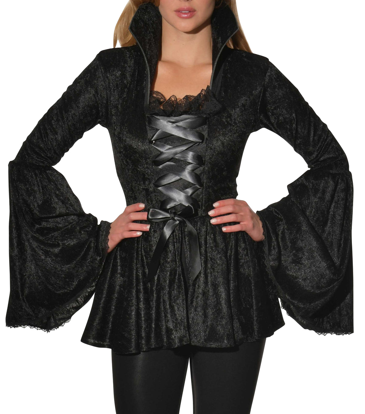 Woman wearing a black crushed velvet corset top with trumpet sleeves