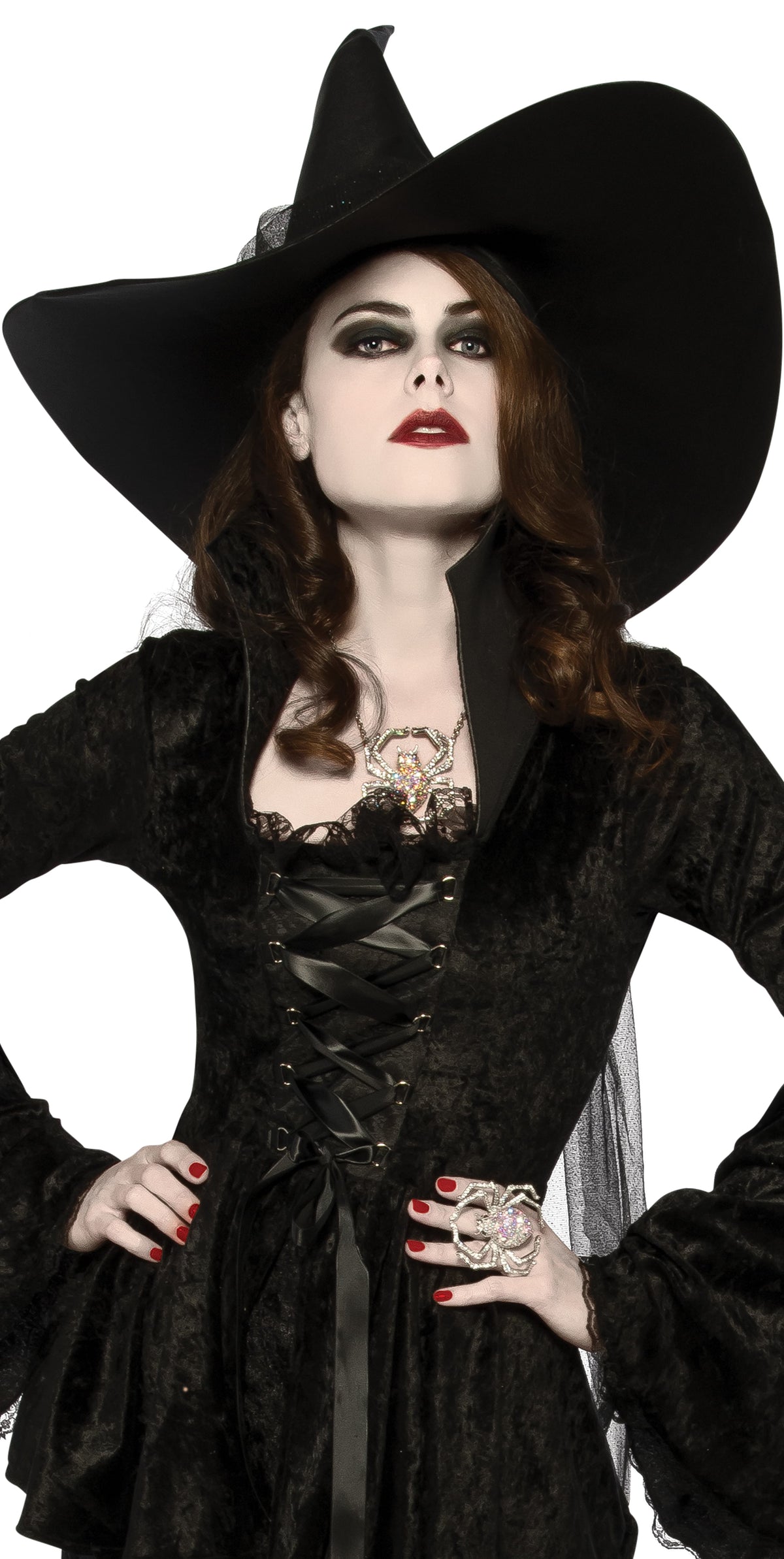 Woman wearing an oversized black pointed witches hat with a wide angular brim