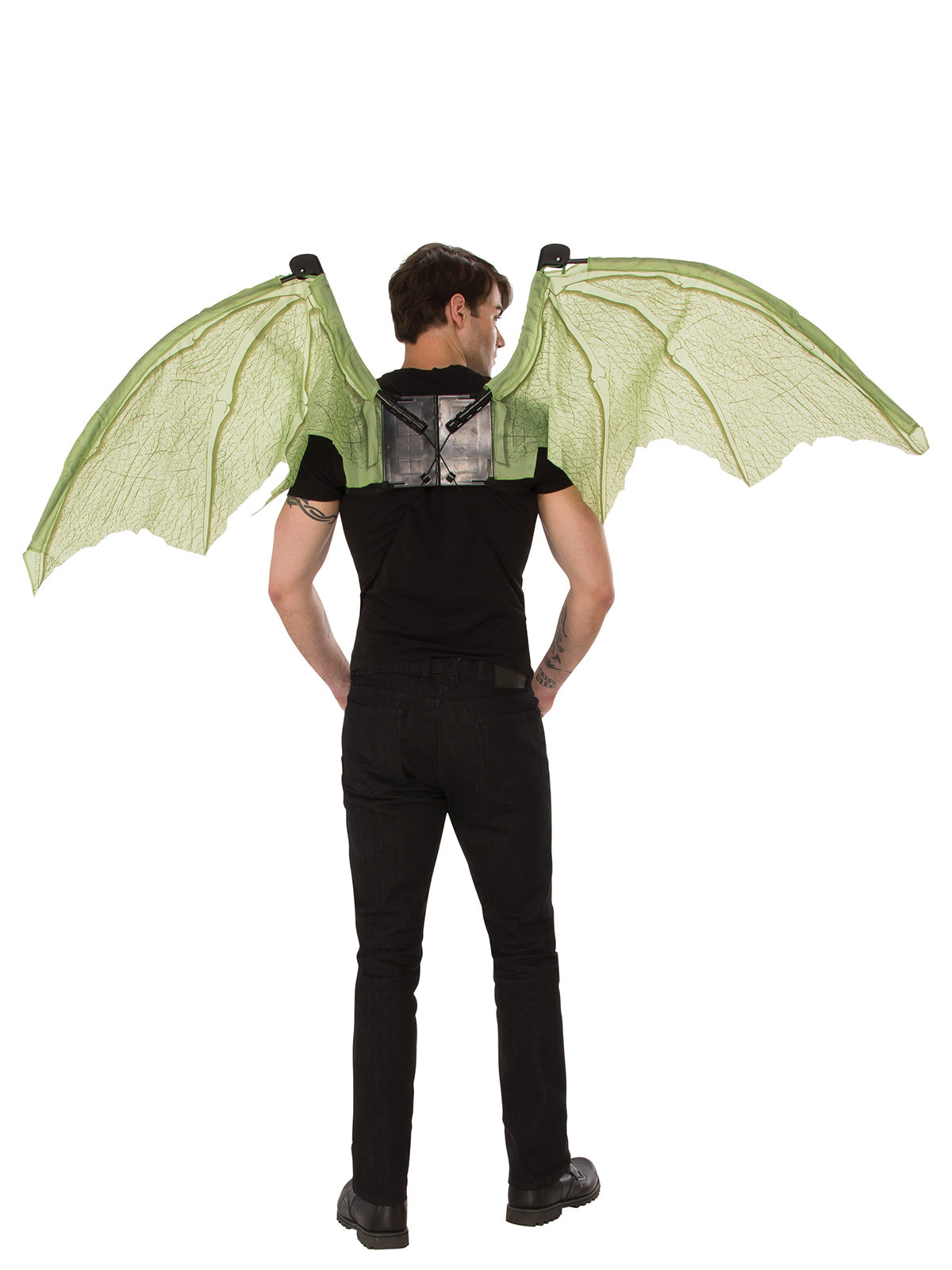 Back view of a man wearing large green dragon wings spread open