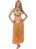 Woman wearing a hula kit with flower lei, floral bra, flower headpiece, wrist cuffs and long hula skirt