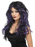 Woman wearing a long wavy black gothic bride wig with purple streaks